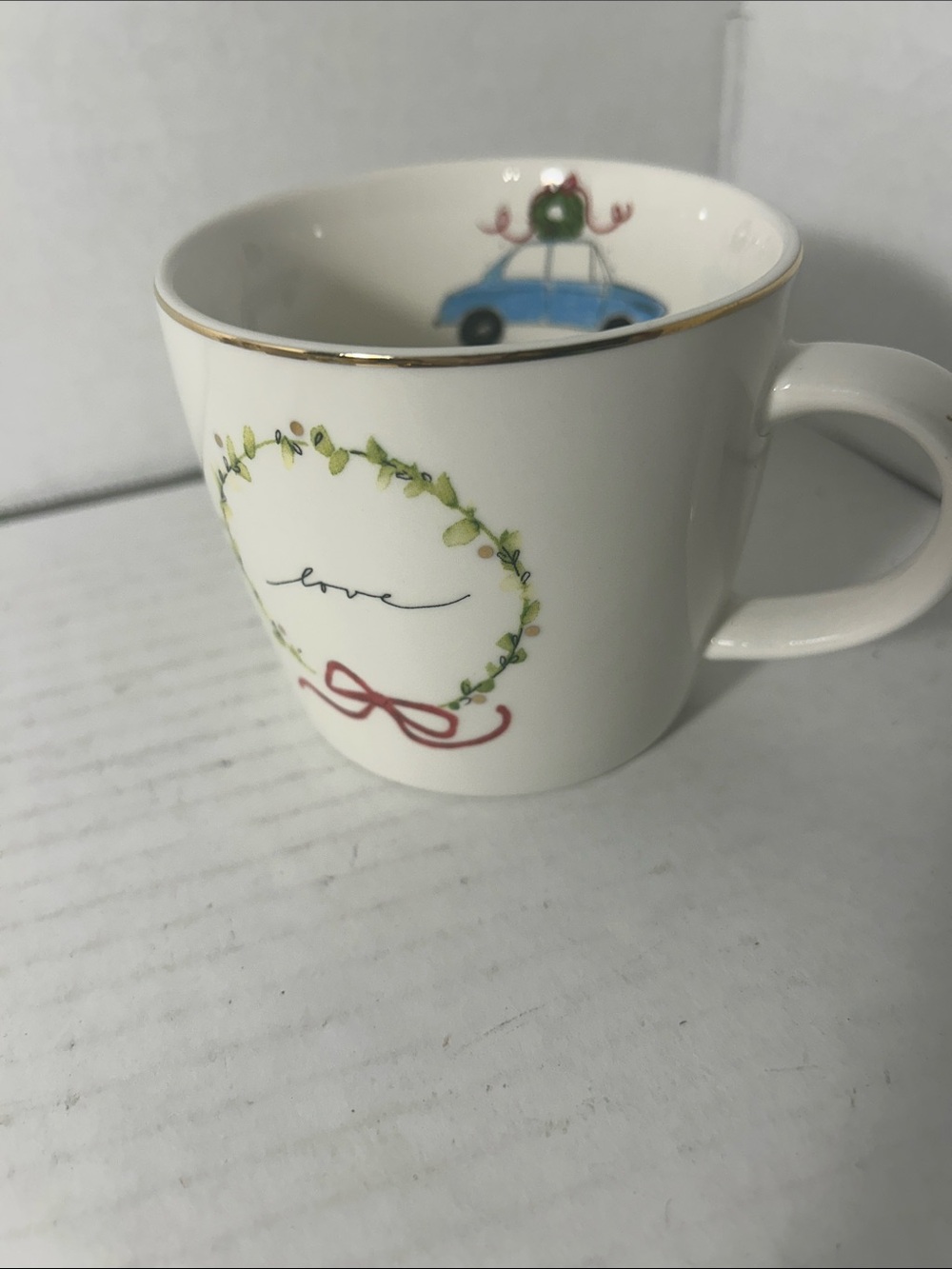 Parkhurst White Ceramic Mug with Green Wreath and Blue Car Accent
